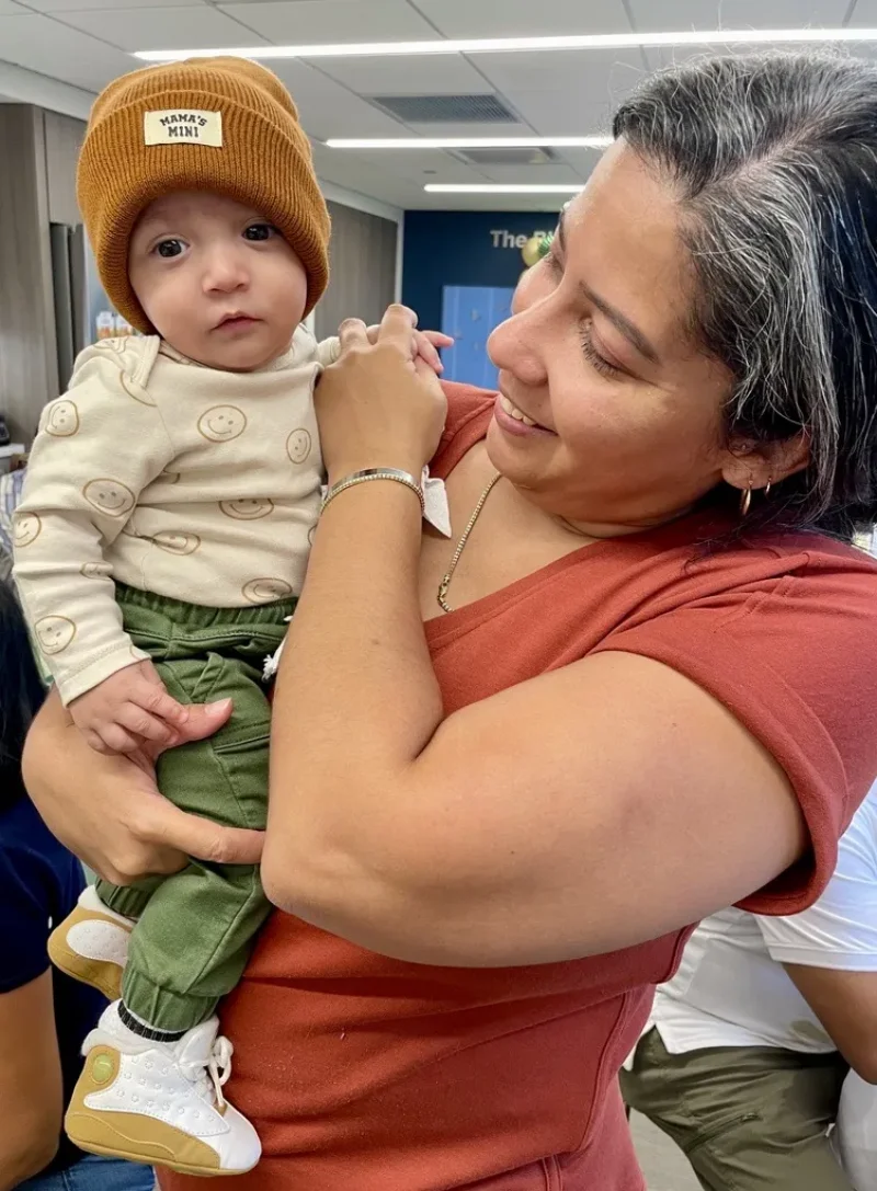 2024-12-30_Photos-and-Video_Blog-Assets_Natalie=and-Marcellus_Elmhurst-Family_Marcellus in the hat with mom